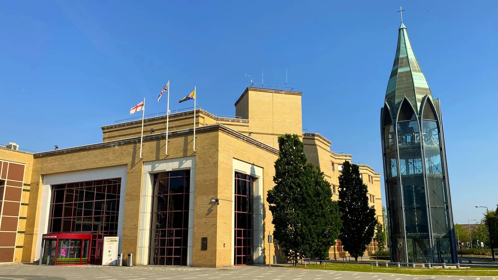 The Basildon Centre, home of Basildon Council, beside the glass bell tower of St Martin's Church in Basildon town centre