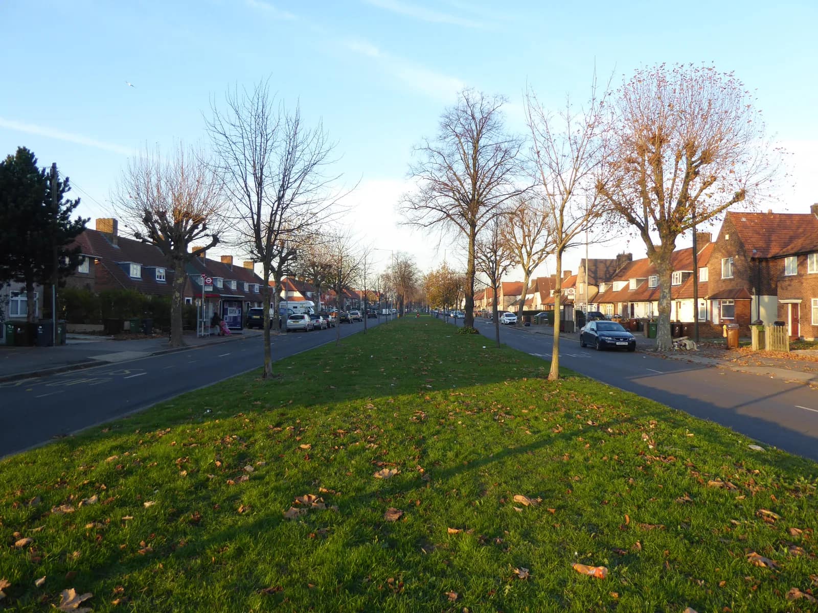 Valence Avenue on the Becontree Estate in Dagenham, with rows of houses either side of a wide grass verge