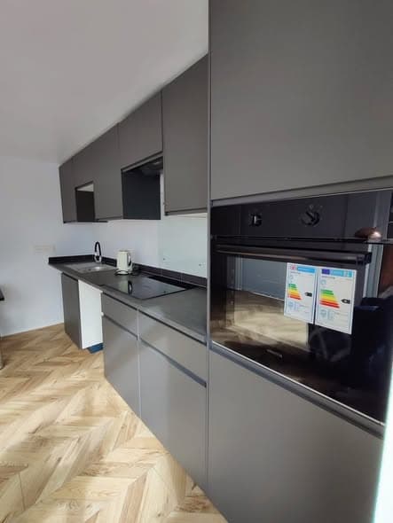 Open-plan kitchen with herringbone floor — photo 5